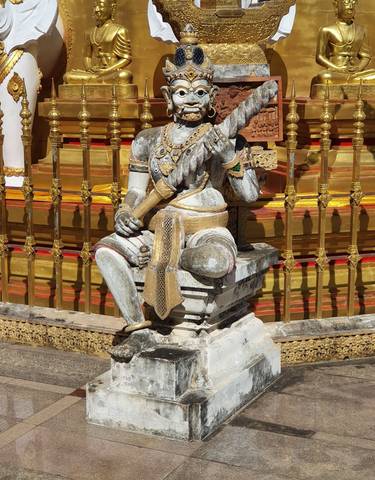 Statue with intricate gold detailing.