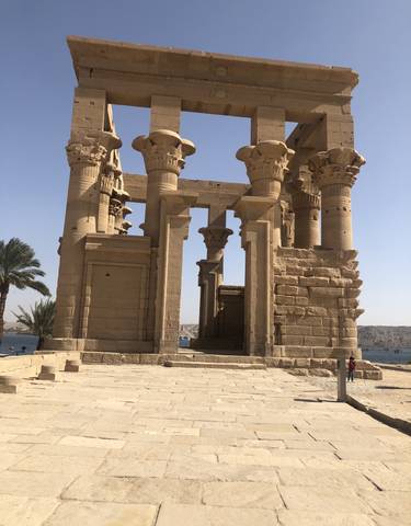 Ancient Egyptian columns overlooking a river.