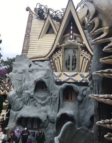 Unique architectural building with tourists.