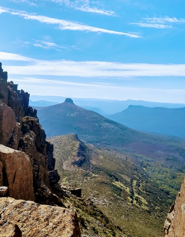 Mountainous landscape viewed from a high vantage point.