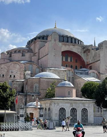 Exterior view of the Hagia Sophia with domes and arches.