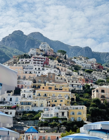 View of a hillside town with colorful houses.