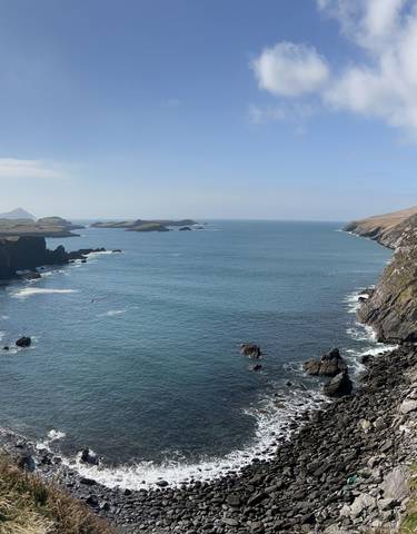 Scenic coastal landscape with rocky shores and ocean.