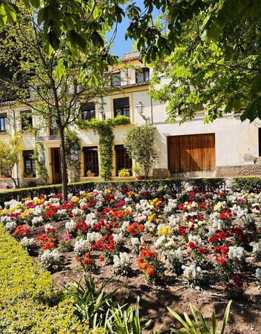 Colorful flower beds in front of charming buildings