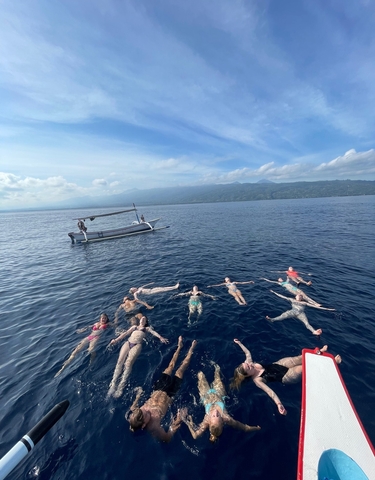 People floating in the ocean.