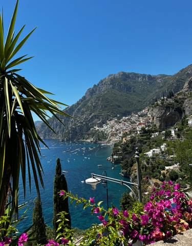 Picturesque view of a coastline with a hillside village in Positano.