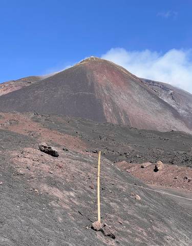 Large volcanic mountain with rugged terrain.
