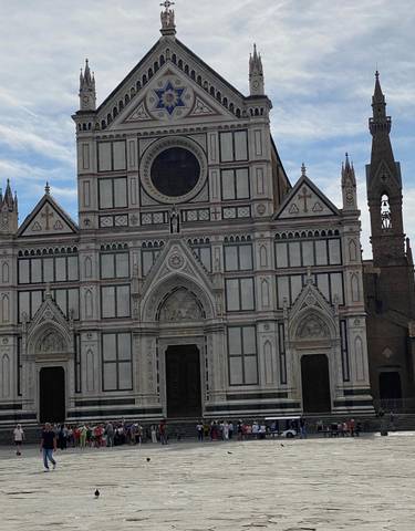 Facade of Basilica di Santa Croce with detailed arches.