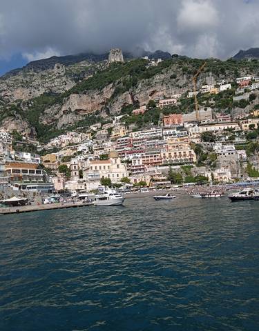 Scenic view of Positano from the sea with colorful buildings.