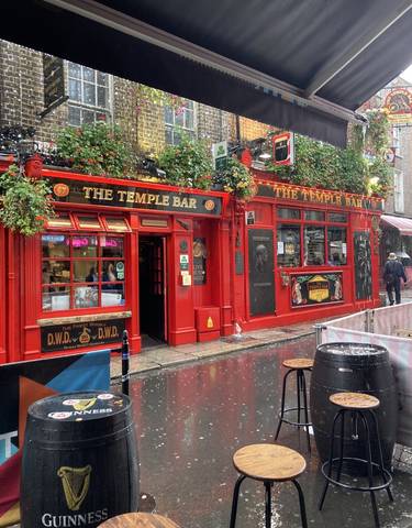 Famous Temple Bar with vibrant red facade in Dublin.