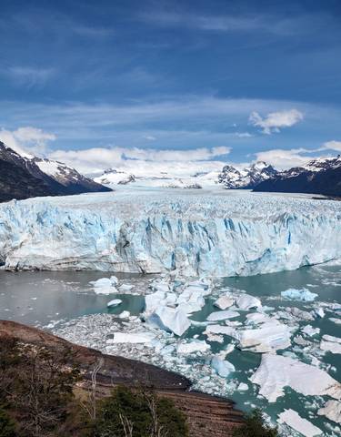 Perito Moreno Glacier with cloudy sky above.