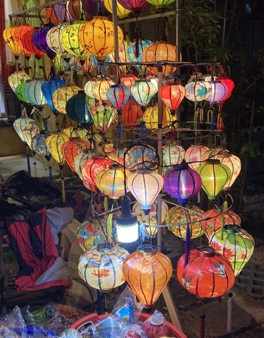 Colorful lanterns on display at night.