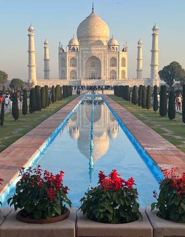 Front view of the Taj Mahal with a reflection in the pool.