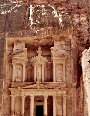 Carved stone facade of an ancient building.