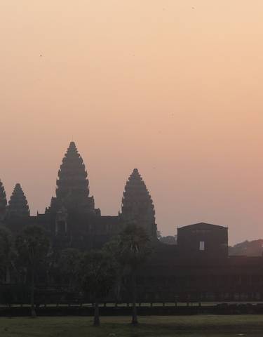 Silhouette of Angkor Wat during sunrise.