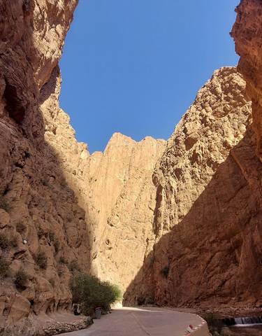 Narrow canyon with steep rock walls.