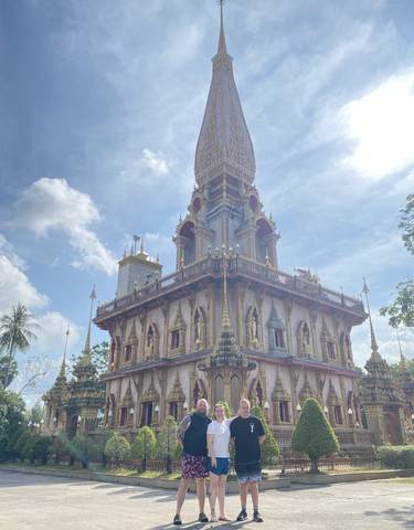 Temple with detailed architecture under a blue sky.