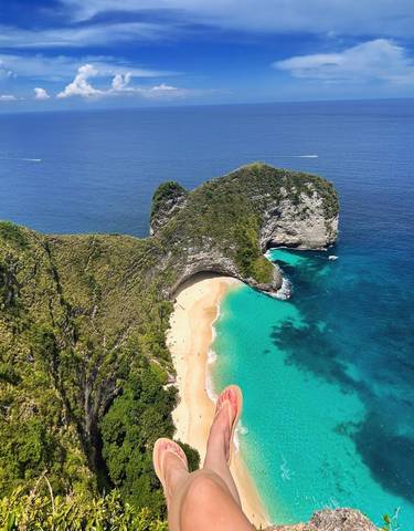 Iconic beach with clear water and unique rock formations.