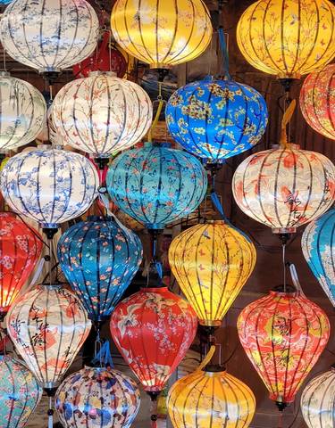Colorful lanterns hanging in a market.