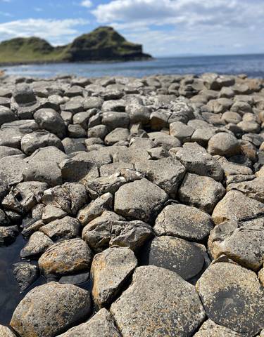 Distinctive hexagonal basalt columns of a coastal feature.