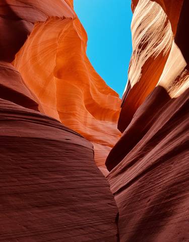Vibrant rock formations with a bright sky at Antelope Canyon.