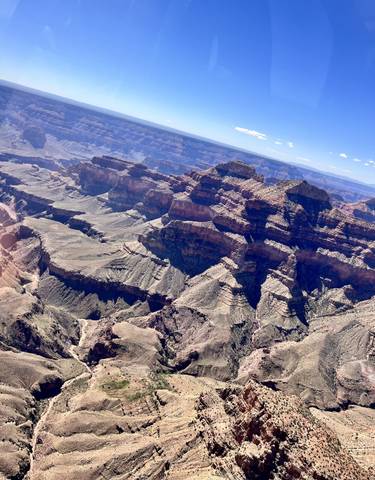 Dramatic aerial view of the Grand Canyon's layered formations.
