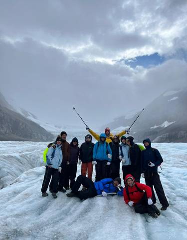 Group of people on a hiking trip in a snowy landscape.