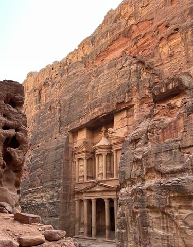 The Treasury at Petra carved into red rock.