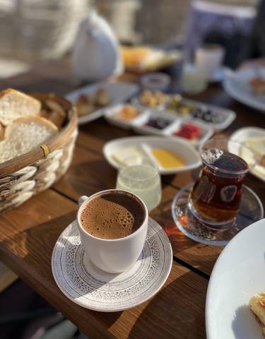Traditional Turkish breakfast with coffee and tea.