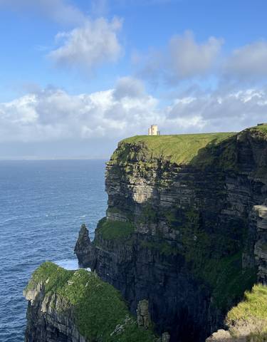 View of a tower on a cliff with ocean views.