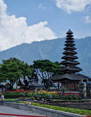 Pagoda with mountain and trees in the background.