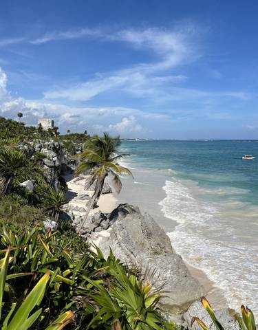 Scenic beach with ruins and turquoise waters at Tulum.