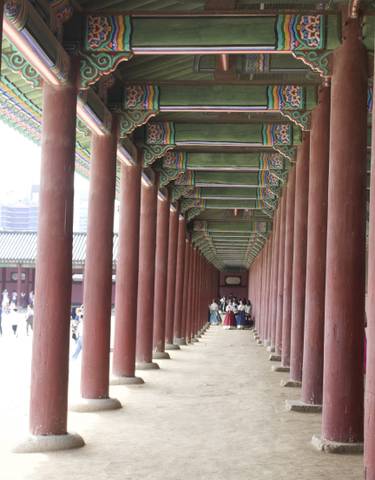 Interior of a historical building with decorative pillars.