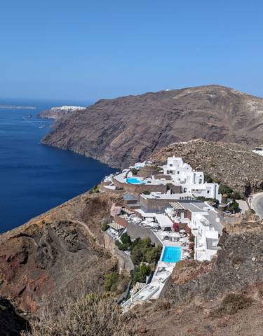Panoramic view of cliffs and sea in Santorini.
