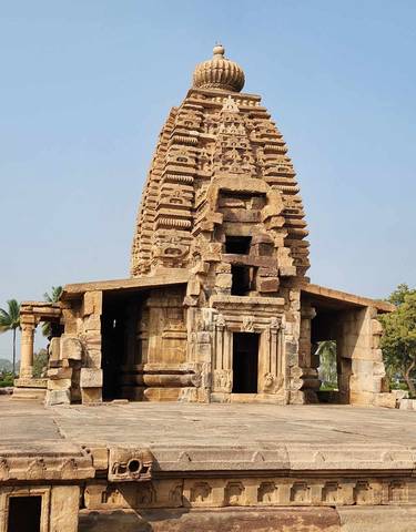Ancient stone temple with detailed carvings in Hampi.