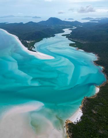 Aerial view of turquoise waters and sandy shores.