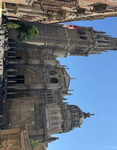 People gathered outside a large cathedral.