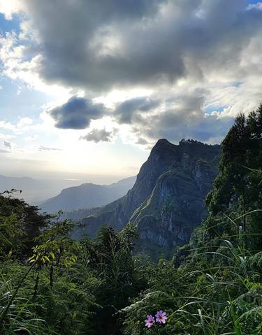 Scenic mountain landscape with clouds.