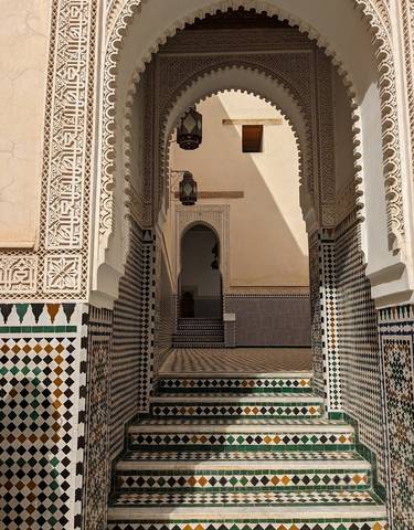 Intricate tile work decorating a historical interior.