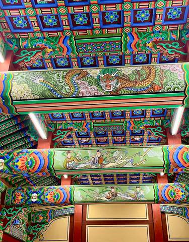 Row of mannequins displaying traditional Korean hanbok dresses.