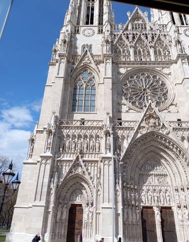 A gothic cathedral with intricate detailing and a rose window.
