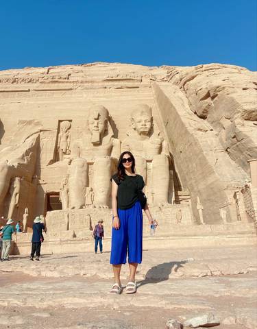 Person in front of the large statues of Abu Simbel.
