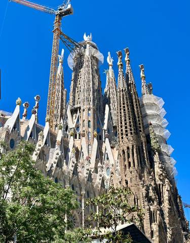 Iconic basilica with intricate spires against a blue sky