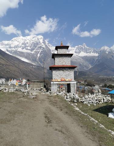 Stupa with mountains in the background