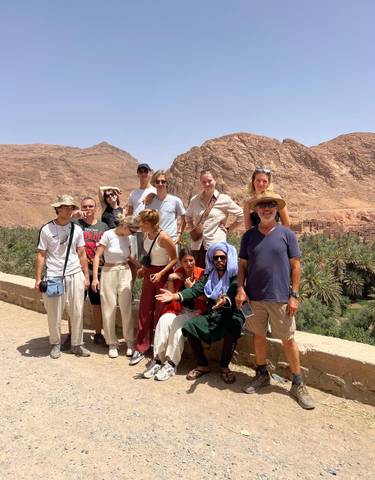 Group photo with scenic desert backdrop.
