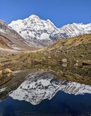 Mountain landscape reflected in a clear lake.