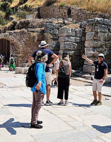 People exploring ancient ruins.