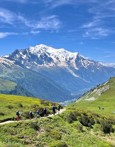 Snow-capped mountain range with a valley below.