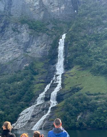 Tall waterfall cascading down a cliffside.