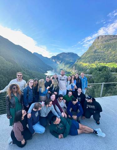 Group photo with fjord landscape